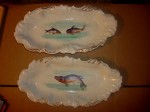 white china plates with pictures of fish