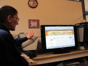 presenter and large screen TV showing Kittanning Online web site