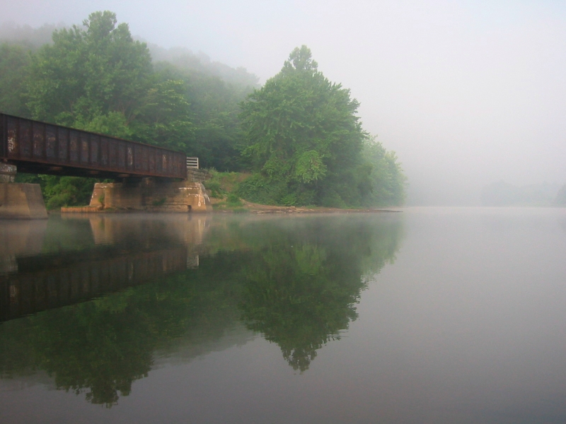 old railroad bridge along the Allegheny River on a misty morning